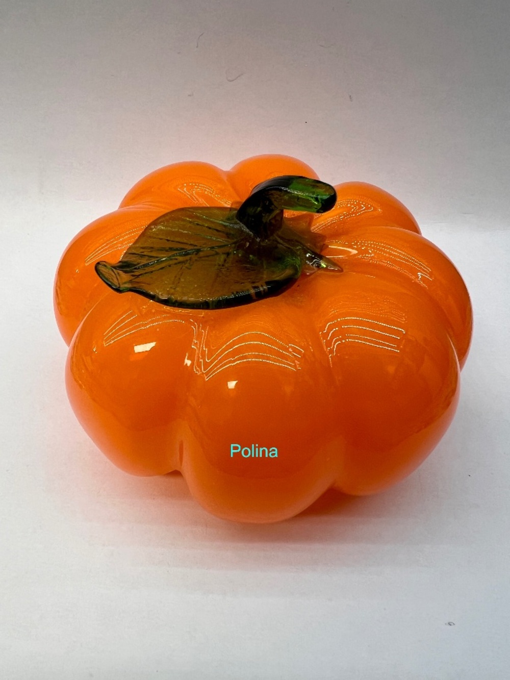 Bright handblown glass pumpkin glossy orange body with a green glass stem&leaf